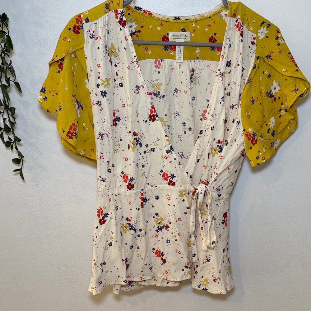 Meadow Rue Anthropologie White Floral Wrap Top with Mustard Flutter Sleeves